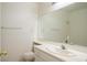 Clean bathroom with a large vanity and mirrored medicine cabinet at 7608 Botany Bay Dr, Las Vegas, NV 89128