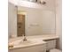 Clean bathroom with a large vanity mirror and toilet at 7608 Botany Bay Dr, Las Vegas, NV 89128