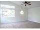 Spacious bedroom with vaulted ceiling, carpet, and window at 7608 Botany Bay Dr, Las Vegas, NV 89128