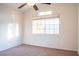 Bright bedroom with carpeted floors and a ceiling fan at 7608 Botany Bay Dr, Las Vegas, NV 89128