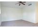 Spacious bedroom with ceiling fan and carpet flooring at 7608 Botany Bay Dr, Las Vegas, NV 89128