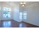 Bright dining room with hardwood floors and large windows at 7608 Botany Bay Dr, Las Vegas, NV 89128