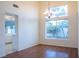 Dining room with hardwood floors, a chandelier, and view of backyard at 7608 Botany Bay Dr, Las Vegas, NV 89128