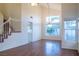 Spacious dining area with hardwood floors and large windows at 7608 Botany Bay Dr, Las Vegas, NV 89128