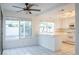 Kitchen features white cabinets, tile floors, and island at 7608 Botany Bay Dr, Las Vegas, NV 89128