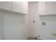 Laundry room with white cabinets and space for washer/dryer at 7608 Botany Bay Dr, Las Vegas, NV 89128