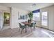 Modern dining area with wood table and four chairs at 7835 Pandora Sky St # 461, North Las Vegas, NV 89084