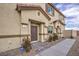 Townhome entrance with dark brown door and landscaping at 7835 Pandora Sky St # 461, North Las Vegas, NV 89084