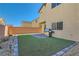 Backyard with artificial turf and patio at 8272 Southern Cross Ave, Las Vegas, NV 89131