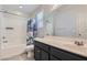 Bathroom with tub, shower, and dark vanity at 8272 Southern Cross Ave, Las Vegas, NV 89131