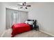 Bedroom with red bedding and ceiling fan at 8272 Southern Cross Ave, Las Vegas, NV 89131