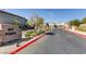 Attractive community entrance with gated access and landscaping at 8272 Southern Cross Ave, Las Vegas, NV 89131