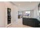 Kitchen with island, pantry, and view into living room at 8272 Southern Cross Ave, Las Vegas, NV 89131