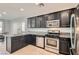 Spacious kitchen with dark cabinets and stainless steel appliances at 8272 Southern Cross Ave, Las Vegas, NV 89131