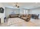 Living room with sectional sofa and ceiling fan at 8272 Southern Cross Ave, Las Vegas, NV 89131