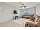 Living room with sectional sofa and large TV at 8272 Southern Cross Ave, Las Vegas, NV 89131