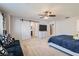 Main bedroom with barn door, en-suite bathroom access, and ample space at 8272 Southern Cross Ave, Las Vegas, NV 89131