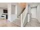 Modern staircase with gray carpeting and white railing, leading to the second floor at 8272 Southern Cross Ave, Las Vegas, NV 89131