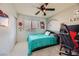 Teal bedding bedroom with a workspace and Hello Kitty decor at 9154 Cazador St, Las Vegas, NV 89123