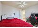 Red bedding bedroom with a home office and loft access at 9154 Cazador St, Las Vegas, NV 89123