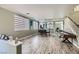 Elegant dining area with wood-look floors and a game table at 9154 Cazador St, Las Vegas, NV 89123