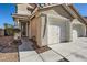 Two-car garage and walkway leading to front door at 9154 Cazador St, Las Vegas, NV 89123