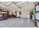 Spacious garage with epoxy floor, ample storage, and refrigerator at 9154 Cazador St, Las Vegas, NV 89123