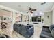 Spacious living room with gray sofas, a large TV, and wood-look floors at 9154 Cazador St, Las Vegas, NV 89123