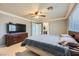 Main bedroom with carpeted floor, ceiling fan, and large bed at 9154 Cazador St, Las Vegas, NV 89123