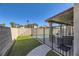 Landscaped backyard with artificial turf and pool at 9154 Cazador St, Las Vegas, NV 89123