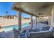 Covered patio with seating overlooking the pool at 9154 Cazador St, Las Vegas, NV 89123