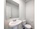 Simple bathroom with pedestal sink and toilet at 9998 Ullom Dr # 16, Las Vegas, NV 89141