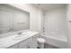 Clean bathroom with a bathtub, toilet and white vanity at 9998 Ullom Dr # 16, Las Vegas, NV 89141