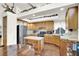 Well-equipped kitchen with an island and wood cabinetry at 10140 Heron Island Ave, Las Vegas, NV 89148