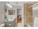 Bathroom with shower/tub combo, vanity, and linen closet at 10374 Midnight Iris St, Las Vegas, NV 89183