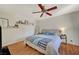 Spacious bedroom with a ceiling fan and king-size bed at 10374 Midnight Iris St, Las Vegas, NV 89183