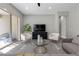 Living area with sectional sofa and glass-top coffee table at 11101 Red Yucca Dr, Las Vegas, NV 89138