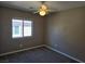 Bedroom featuring neutral carpet, a ceiling fan, and a bright window for natural light at 1142 Grass Pond Pl # 3, Henderson, NV 89002