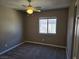 Bedroom with neutral carpet, a window, and a ceiling fan for added comfort at 1142 Grass Pond Pl # 3, Henderson, NV 89002