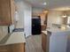 Cozy kitchen with wooden cabinets and appliances in a modern living space at 1142 Grass Pond Pl # 3, Henderson, NV 89002