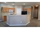 Updated kitchen featuring wooden cabinets and modern appliances at 1142 Grass Pond Pl # 3, Henderson, NV 89002