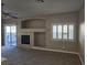 Comfortable living room with fireplace, large window, and access to the backyard at 1142 Grass Pond Pl # 3, Henderson, NV 89002