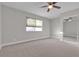 Bright bedroom with ceiling fan, carpet, and large window at 1252 Little Sidnee Dr, Las Vegas, NV 89123