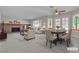 Casual dining area with a brick fireplace and adjacent seating area at 1252 Little Sidnee Dr, Las Vegas, NV 89123