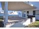 Covered patio with flagstone flooring and built-in seating at 1252 Little Sidnee Dr, Las Vegas, NV 89123