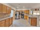 Bright kitchen featuring stainless steel appliances and wood cabinets at 1320 Robbers Roost Ave, Henderson, NV 89012