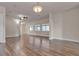 Hardwood floor living room with high ceiling and access to dining and kitchen at 1320 Robbers Roost Ave, Henderson, NV 89012