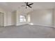 Large main bedroom with high ceilings, carpet, and ceiling fan at 1320 Robbers Roost Ave, Henderson, NV 89012