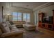 Relaxing living room with sectional sofa and hardwood floors at 1349 Via Savona Dr, Henderson, NV 89052