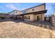 Large backyard with covered patio, pergola, and gravel landscaping at 170 Rolling Fields Ct, Henderson, NV 89012